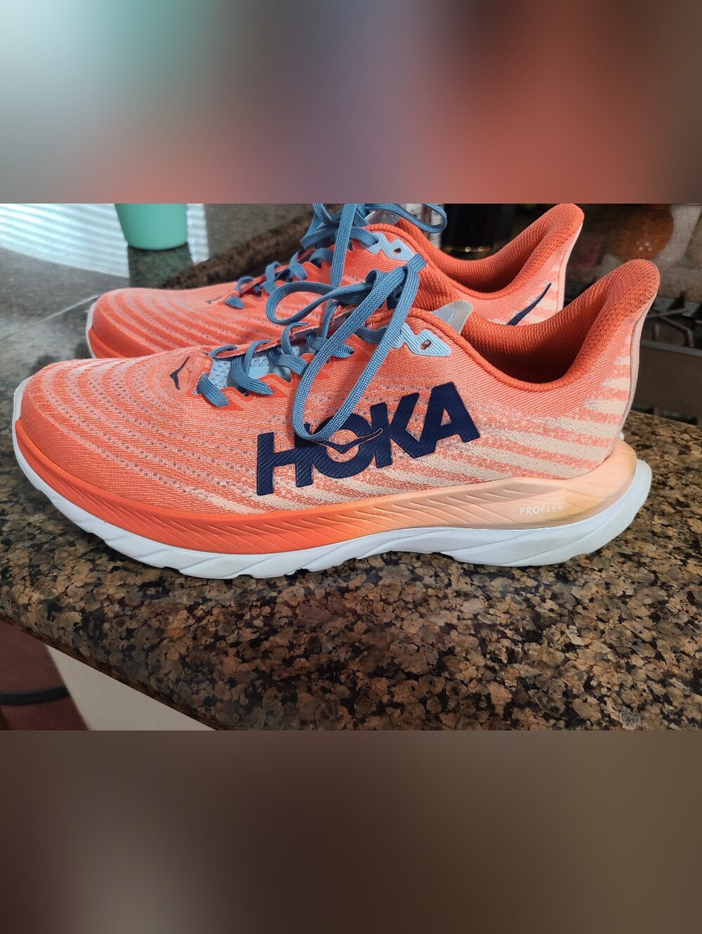 Hoka Women's Orange Coral Running Shoes with Blue Accents
